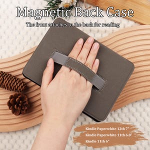 May include: A gray Kindle case with a hand strap. The case has the text "Magnetic Back Case" and "The front attaches to the back for reading". Compatible with Kindle Paperwhite 12th 7", Kindle Paperwhite 11th 6.8", and Kindle 11th 6".