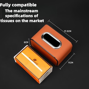 K&ouml;nnte beinhalten: Braune Taschentuchbox mit silberner Umrandung, Ma&szlig;e 17,5 cm x 11 cm x 8 cm. Der Text auf dem Bild lautet: "Voll kompatibel. Die g&auml;ngigen Spezifikationen von Taschent&uuml;chern auf dem Markt."