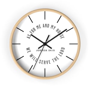May include: A round wall clock with a light wood frame. The white clock face features black hands and hour markers. The text "AS FOR ME AND MY HOUSE WE WILL SERVE THE LORD" is printed in a circular pattern.