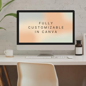 May include: A desktop computer with the words "FULLY CUSTOMIZABLE IN CANVA" on the screen. The computer sits on a white desk with a white chair, a coffee cup, and a decorative bottle.