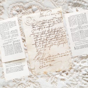 May include: Three pieces of aged, off-white paper featuring dark brown ink. The central piece displays dense, handwritten cursive script, while the two flanking pieces contain printed French text with headings like Pour le Samedi and L'Annonciation.