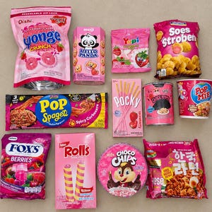 May include: A collection of various snack food packages in shades of pink, red, and yellow. The items include Oishi Sponge Crunch, Hello Panda, Yupi Strawberry Kiss, Soes Stroberi, Pop Spageti, Pocky, Chick Peppe, Pop Mie, Fox's Berries, Rolls, Choco Chips, and Korean Ramen.
