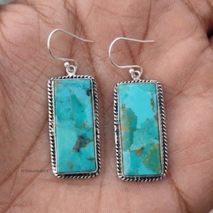 May include: A set of three ceramic mugs with a speckled, matte finish. The mugs are in shades of cream, light gray, and dark gray. Each mug has a simple, minimalist design, perfect for coffee or tea.