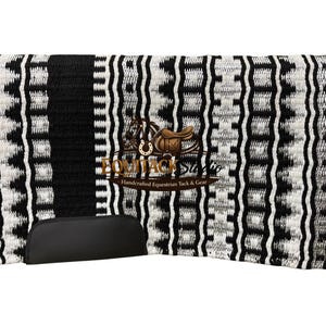 May include: Black and white patterned saddle pad with a black border and a black leather-like piece at the bottom. The pad has a repeating geometric design. The logo "EquiTack Studio" is visible in the center.
