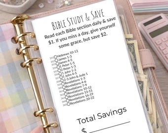 May include: A pink binder with gold accents holds a Bible study and savings tracker. The text "Bible Study & Save" is at the top, with instructions to save $1 daily. The tracker lists Bible sections and a space to calculate total savings.