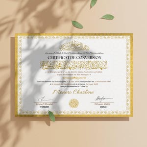 May include: A gold-framed certificate with ornate borders and Arabic calligraphy. The certificate, titled "CERTIFICAT DE CONVERSION," includes text in French and Arabic, with signatures and dates. The document is a conversion certificate.
