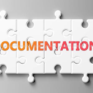 Könnte beinhalten: Grafik von vier weißen Puzzleteilen, die ein Rechteck bilden. Das Wort "DOCUMENTATION" ist in Orange und Rot über die Puzzleteile geschrieben.