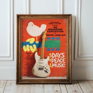 Woodstock Music & Art Fair poster with guitar, dates, and performers.