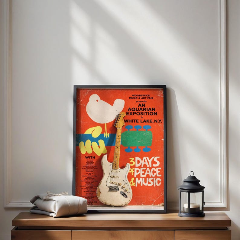 Woodstock Music & Art Fair poster with electric guitar and lantern.