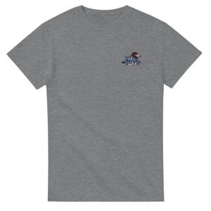 May include: A heather gray short-sleeve t-shirt featuring a small embroidered graphic on the left chest. The design depicts a stylized mountain peak in shades of blue and white, positioned beneath a dark red circular sun, with Japanese text below.