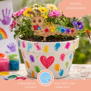 May include: A white flower pot decorated with colourful handprints and a red heart. The pot contains vibrant flowers and a wooden caterpillar decoration with colourful gems. Text on the image includes "DIGITAL DOWNLOAD" and "COMMERCIAL LICENCE".