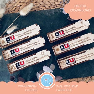May include: A collection of laser-cut wooden boxes, each with a red and white "au" logo and a small chocolate treat inside. The boxes feature German text and decorative designs. The image also includes the text "DIGITAL DOWNLOAD".
