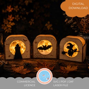 Puede incluir: Tres cajas de luz de madera arqueadas con recortes circulares y fondos brillantes similares a la luna. La caja izquierda muestra una silueta de vampiro, la central un murciélago y la derecha una bruja en escoba. Texto DIGITAL DOWNLOAD.