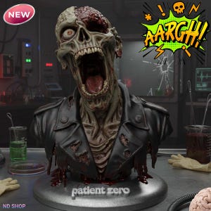 May include: A detailed bust of a zombie with exposed skull and open mouth, wearing a black leather jacket. The bust is on a silver base with the text "patient zero". A speech bubble says "AARGH!" and a "NEW" sticker is in the corner.