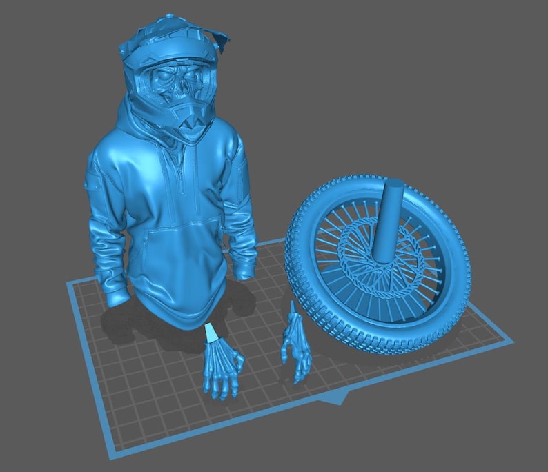 May include: A light blue 3D-printed model of a motocross helmet, hoodie, skeleton hands, and a motorcycle wheel. The helmet has a detailed design, and the hoodie has a zipper. The wheel has spokes and a tire.