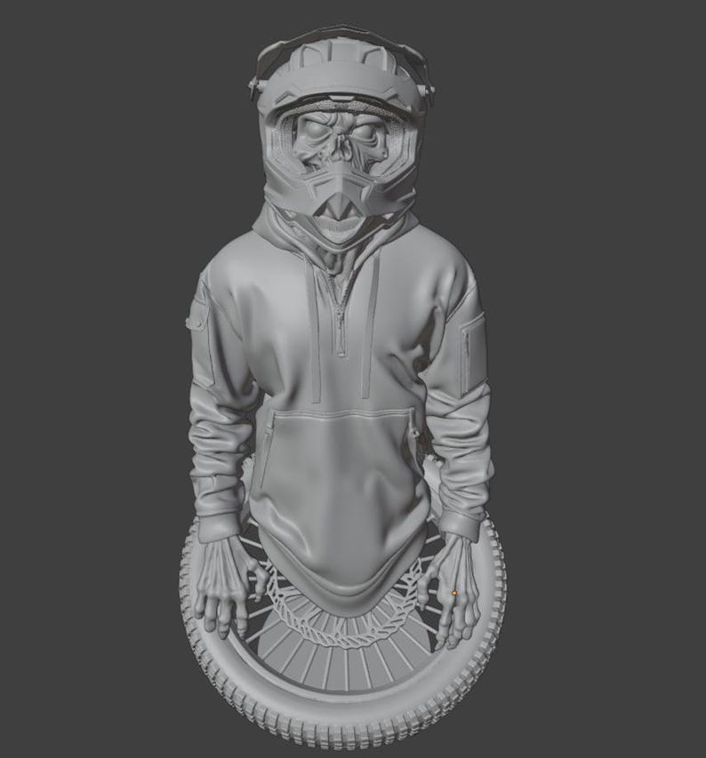 May include: A gray sculpture of a figure wearing a motocross helmet with a skull face, a hooded sweatshirt, and a motorcycle wheel base. The figure's hands rest on the wheel. The sculpture is set against a gray background.