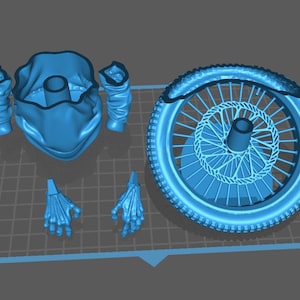 May include: A blue 3D-printed model of a motorcycle wheel, a helmet, and skeletal hands. The wheel has a detailed spoke design and a tire tread. The helmet has a neck covering and the skeletal hands are in a grasping position.