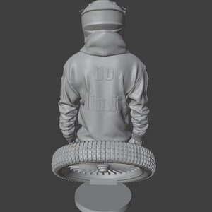 May include: A gray sculpture of a person wearing a motorcycle helmet and hoodie. The hoodie has the words "NO LIMIT" embossed on the back. The figure is holding a motorcycle tire, mounted on a round base.