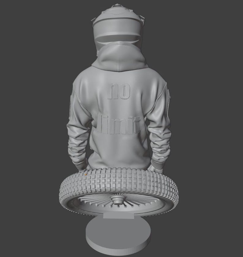 May include: A gray sculpture of a person wearing a motorcycle helmet and hoodie. The hoodie has the words "NO LIMIT" embossed on the back. The figure is holding a motorcycle tire, mounted on a round base.