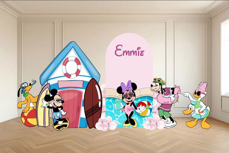 May include: A decorative party backdrop set featuring a blue and white beach house, a pink arched panel with the name Emmie, and cartoon characters including Mickey, Minnie, Pluto, Goofy, and Daisy Duck in summer attire with beach accessories.