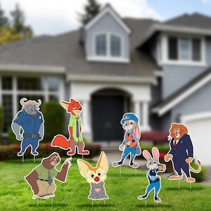 May include: A collection of colorful yard decorations featuring characters from the animated movie Zootopia. The characters include a fox, a bunny, a lion, a sloth, a buffalo, and a fennec fox, all standing on metal stakes.