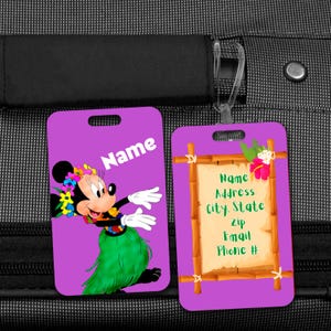 May include: Two purple luggage tags. One features Minnie Mouse in a hula outfit with the word "Name". The other tag has a bamboo frame with space for contact information, including name, address, city, state, zip, email, and phone number.