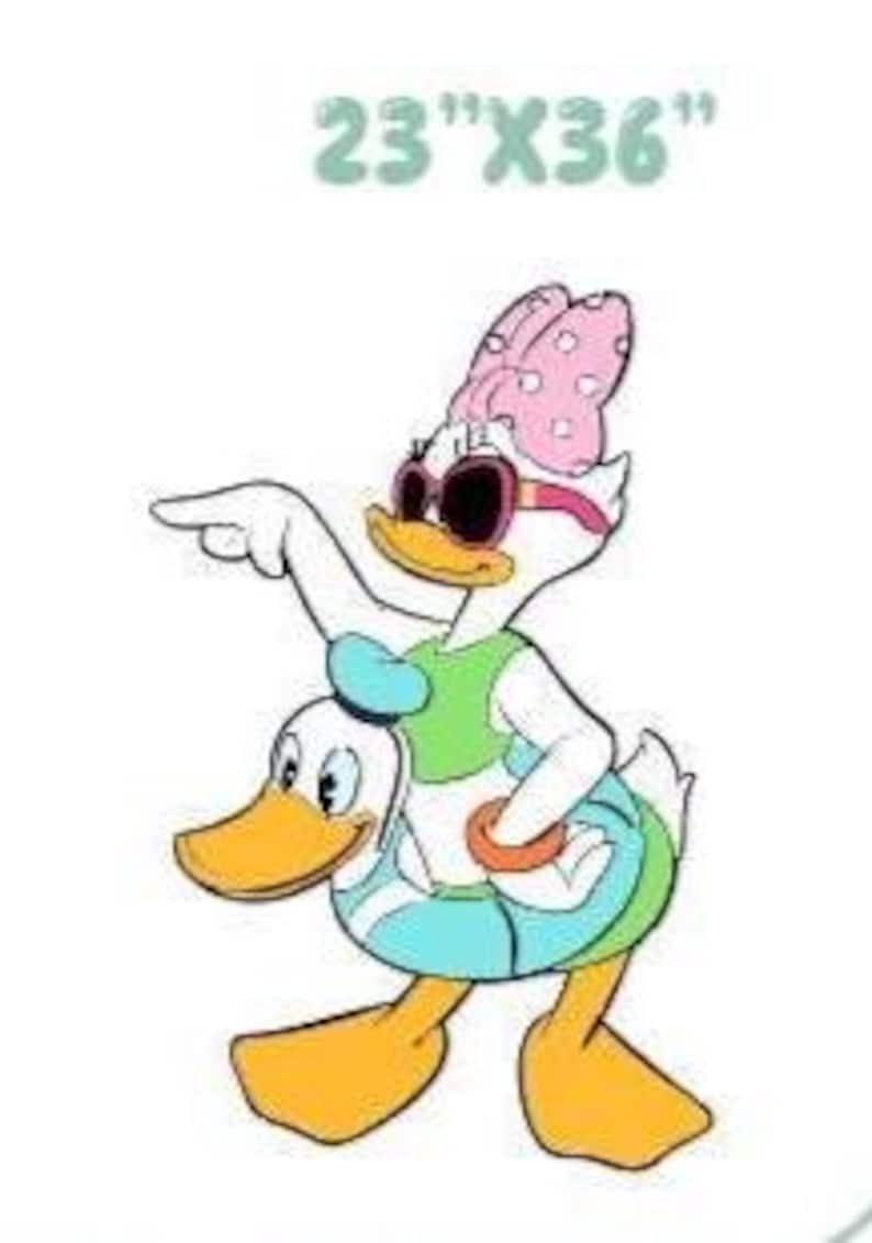 May include: A graphic illustration of Daisy Duck wearing a pink polka dot bow, sunglasses, and a green top, pointing with one wing while standing inside a blue inflatable swim ring. The text 23"X36" is printed above the character in light green.