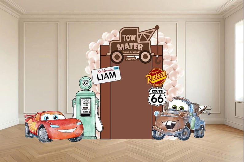 May include: A themed party backdrop featuring cartoon car characters. Includes a red race car, a tow truck, and a gas pump. The backdrop has a brown door with a sign that says "Liam". The Route 66 sign is also visible.
