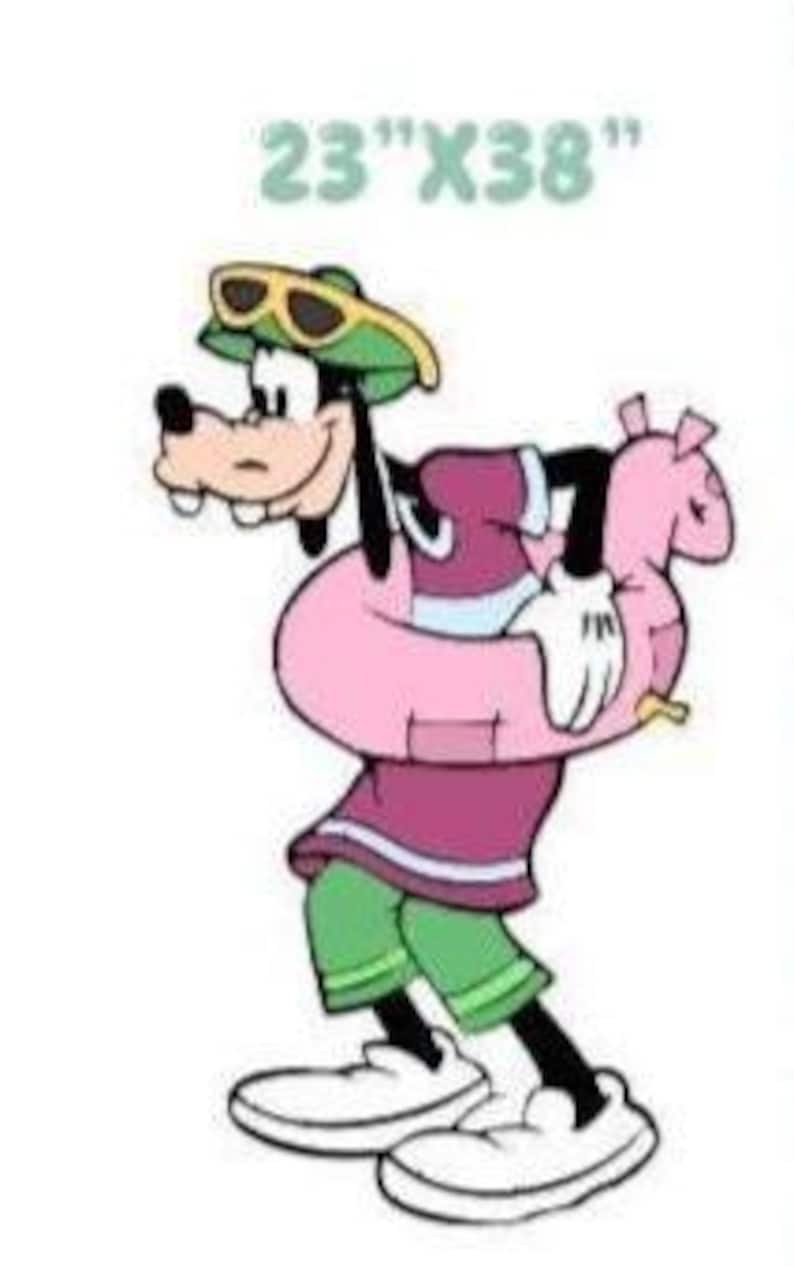 May include: A cartoon character illustration of Goofy wearing a green hat with yellow sunglasses, a purple shirt, and green shorts. The character is holding a pink inflatable pool ring. The text 23"X38" is printed in light blue above the character.