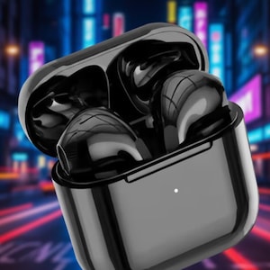 May include: Black wireless earbuds in a charging case. The earbuds are glossy and reflect light. The case is rectangular with rounded edges and a small white indicator light. The background is blurred with neon lights.