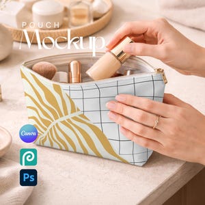 May include: A zippered cosmetic pouch featuring a split design with a white and black grid pattern on one side and a mustard yellow abstract leaf print on the other. The pouch is open and contains various makeup items including a foundation bottle.