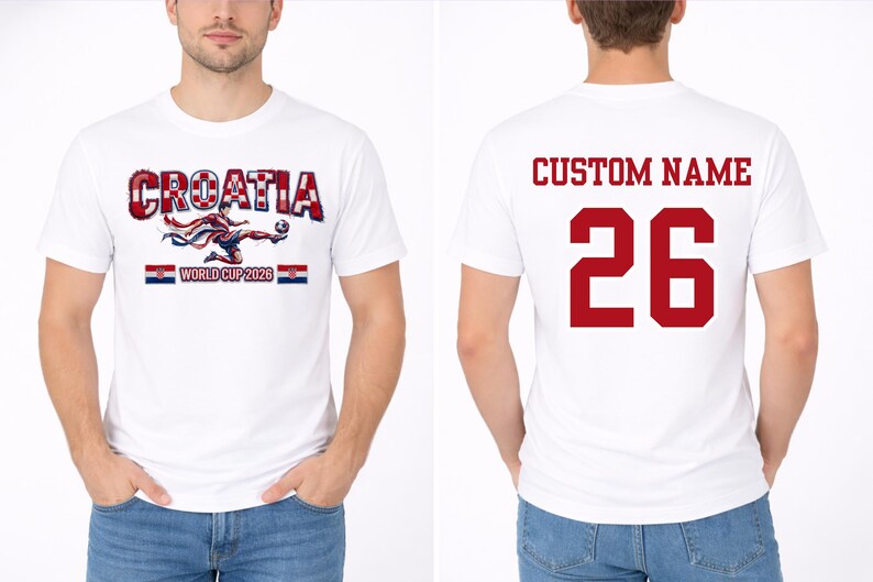 May include: White t-shirt featuring "CROATIA" in red and white, with a soccer player graphic and "WORLD CUP 2026". The back displays "CUSTOM NAME" and the number "26" in red. A soccer-themed apparel item.