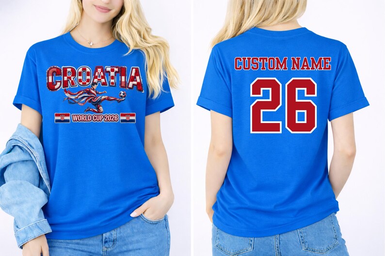 May include: Blue t-shirt with "CROATIA" in red and white, a soccer player graphic, and "WORLD CUP 2026". The back features "CUSTOM NAME" and the number "26" in red with a white outline.
