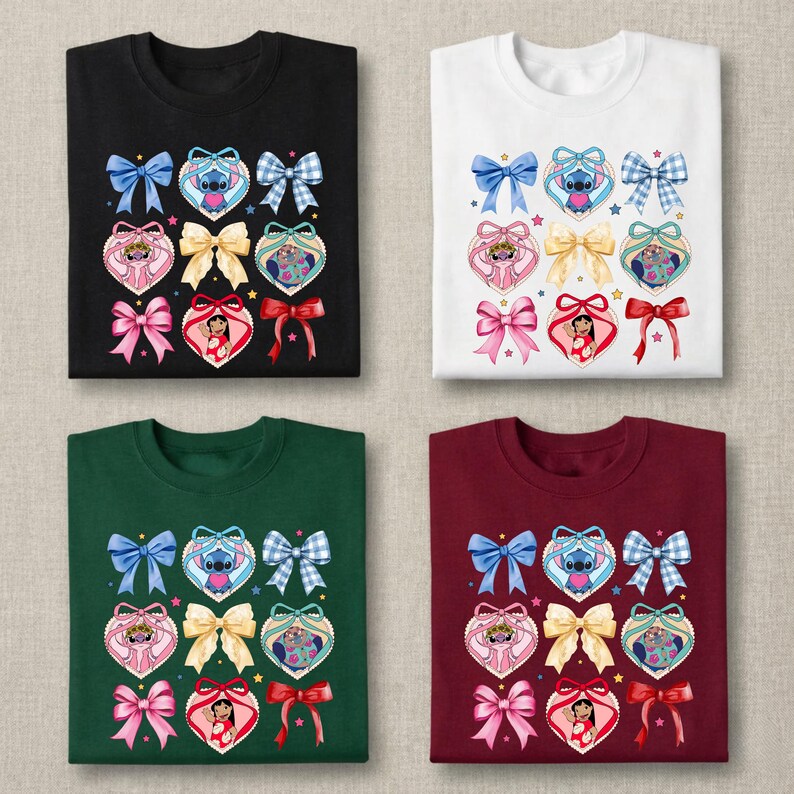May include: Four t-shirts in black, white, dark green, and maroon, each featuring a repeating graphic print of blue bows, yellow bows, and heart-shaped frames containing illustrations of Stitch and Lilo from Lilo and Stitch with small stars.