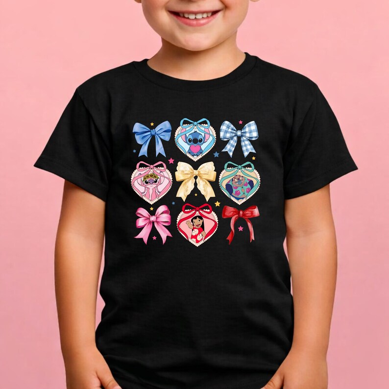 May include: A black t-shirt featuring a grid of nine decorative elements, including various colored bows and heart-shaped frames containing cartoon characters like Stitch, Angel, and Lilo, accented with small colorful stars scattered throughout.
