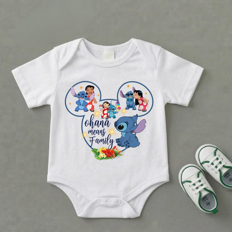 May include: A white short-sleeve baby bodysuit featuring a graphic of Stitch and Lilo inside a Mickey Mouse ear outline. The text reads Ohana means Family, accompanied by colorful tropical flowers and small yellow stars on the front center.