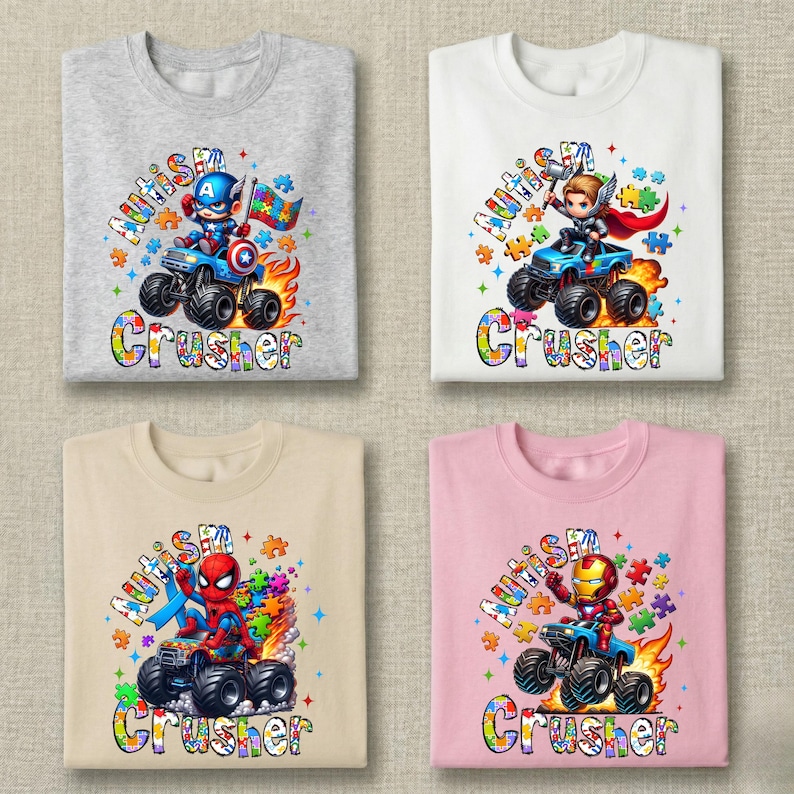 Puede incluir: Cuatro camisetas con gr&aacute;ficos de superh&eacute;roes. Cada camiseta presenta un superh&eacute;roe montado en un monster truck con la palabra "Crusher" debajo. Las camisetas son grises, blancas, beige y rosas. El texto "Autismo" est&aacute; encima del superh&eacute;roe.