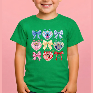 May include: A bright green short-sleeve t-shirt featuring a central graphic print of various bows and heart-shaped frames. The design includes illustrations of Stitch, Angel, and Lilo from Lilo and Stitch, interspersed with blue, pink, and red bows.