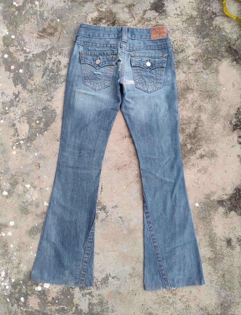 May include: A trio of ceramic mugs with a speckled, matte finish in light blue, cream, and grey. The mugs have a simple, modern design and a comfortable handle, perfect for tea or coffee.