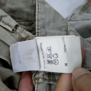 May include: A set of three ceramic mugs with a speckled, matte finish. The mugs are in shades of cream, light gray, and dark gray. Each mug has a simple, minimalist design, perfect for coffee or tea.