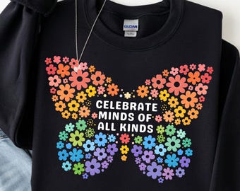 May include: Black sweatshirt with a colorful floral butterfly design. The butterfly is made of flowers in shades of red, orange, yellow, green, blue, and purple. The text "CELEBRATE MINDS OF ALL KINDS" is in the center.
