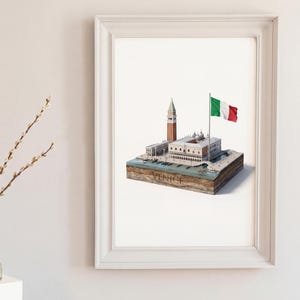 Puede incluir: Impresión artística enmarcada de Venecia, Italia, con una maqueta arquitectónica detallada del Campanile de San Marcos, el Palacio Ducal y la bandera italiana. La palabra "VENICE" está en la base del modelo. La impresión está en un marco blanco.