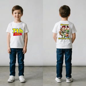 May include: White t-shirt with the text "7th Birthday" in yellow and red. The back of the shirt features a graphic of characters and the text "Mommy Birthday Boy". The shirt is paired with blue jeans and white sneakers.