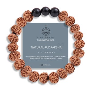 May include: A bracelet with brown Rudraksha beads and black onyx beads. A grey card displays the text "SIMPLI BASIC THOUGHTFUL GIFT NATURAL RUDRAKSHA ALL CHAKRAS". The bracelet is designed to balance all chakras.