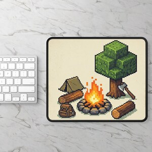 May include: Pixelated camping scene mousepad featuring a campfire, tent, backpack, tree, axe, and logs. The design has a retro video game aesthetic with a beige background and black border. The campfire has orange and yellow flames.