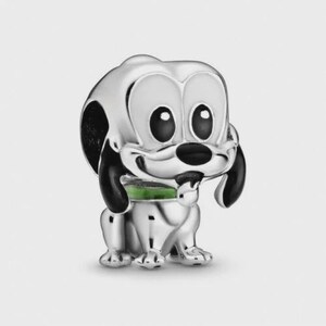 May include: A silver charm of a cartoon dog with large, black eyes and ears. The dog has a black nose and a green collar. The charm is highly detailed and has a polished finish, giving it a shiny appearance. The dog is in a sitting position.