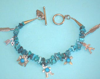 Vintage Sterling silver 8 Charms on a Turquoise Nugget Bracelet (FRED HARVEY ERA)