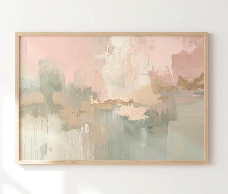 May include: Abstract art print in a light wooden frame. The artwork features a soft color palette of pink, green, beige, and gold. The painting has a textured, layered appearance, with visible brushstrokes and a modern aesthetic.