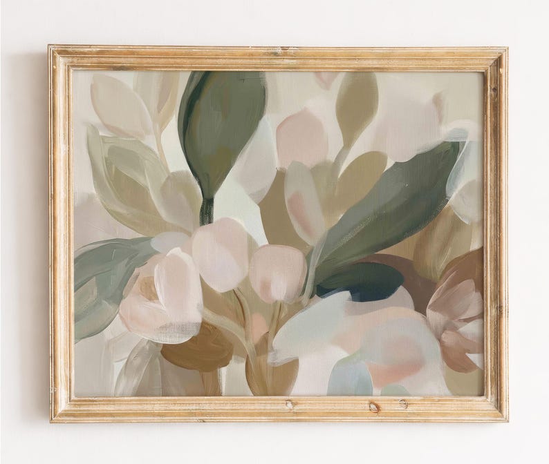 May include: An abstract floral painting in a gold-toned wooden frame. The artwork features soft, muted colours including shades of green, beige, and pink. The brushstrokes create a layered effect, depicting stylized leaves and flowers. The overall aesthetic is calming and natural.