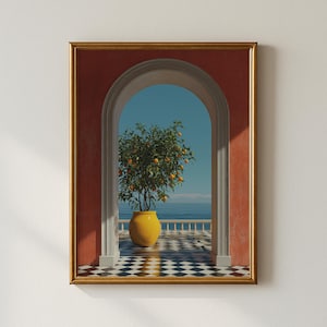 May include: A framed art print featuring an orange tree in a yellow pot, set against a backdrop of a blue sea and sky. The tree is positioned within an arched doorway, with a red wall and a black and white checkered floor. The frame is gold.